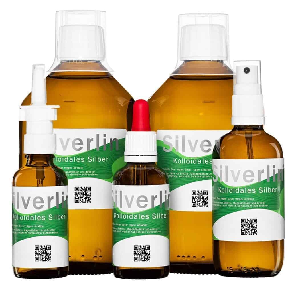 Silverlin® Kolloidales Silber Comfortset Plus mit mehreren Braunglasflaschen und verschiedenen Sprühaufsätzen auf hellem Hintergrund.